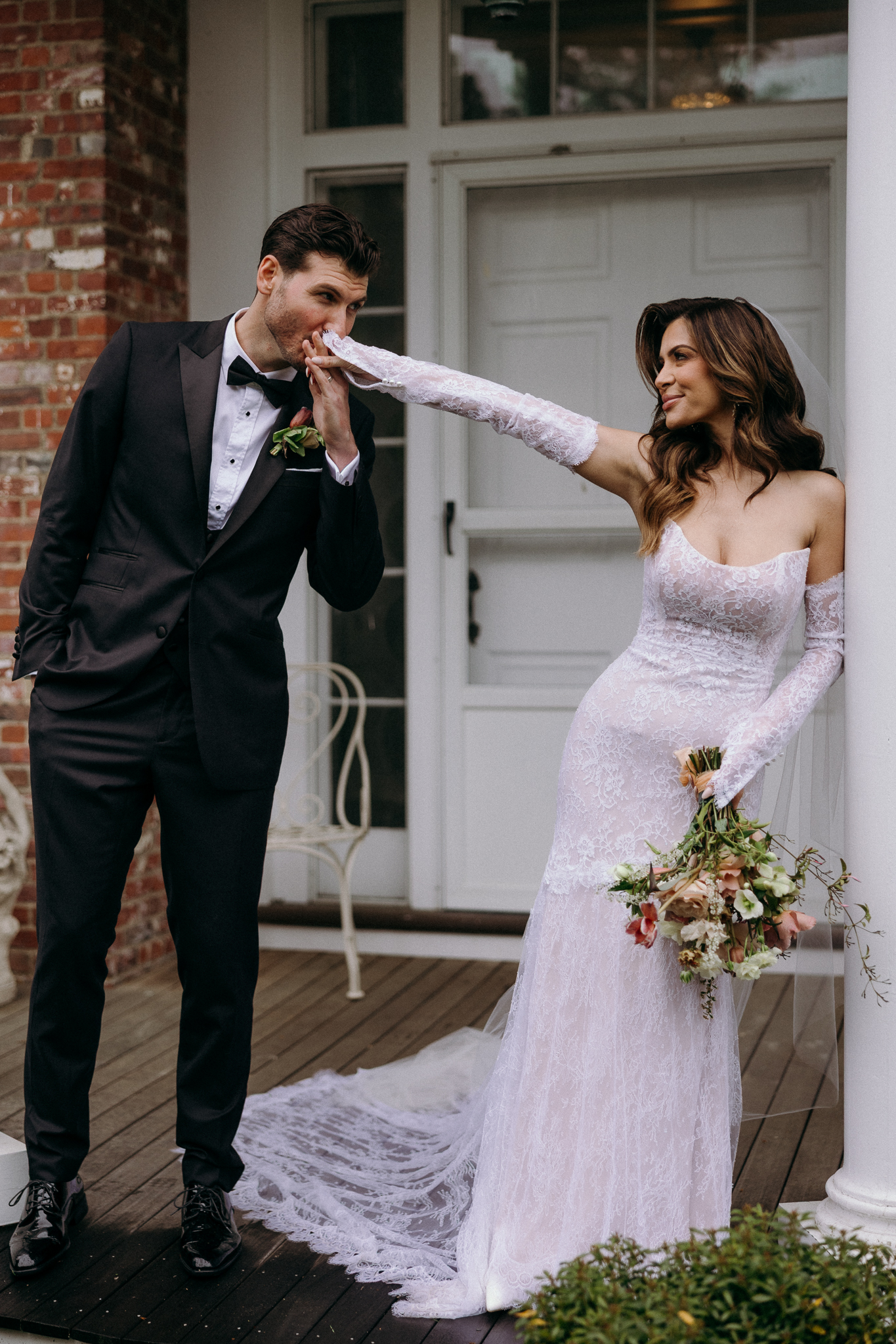 Bride and groom kissing hand at alrich mansion wedding | Rhode Island Wedding Photographer Liz Bashaw