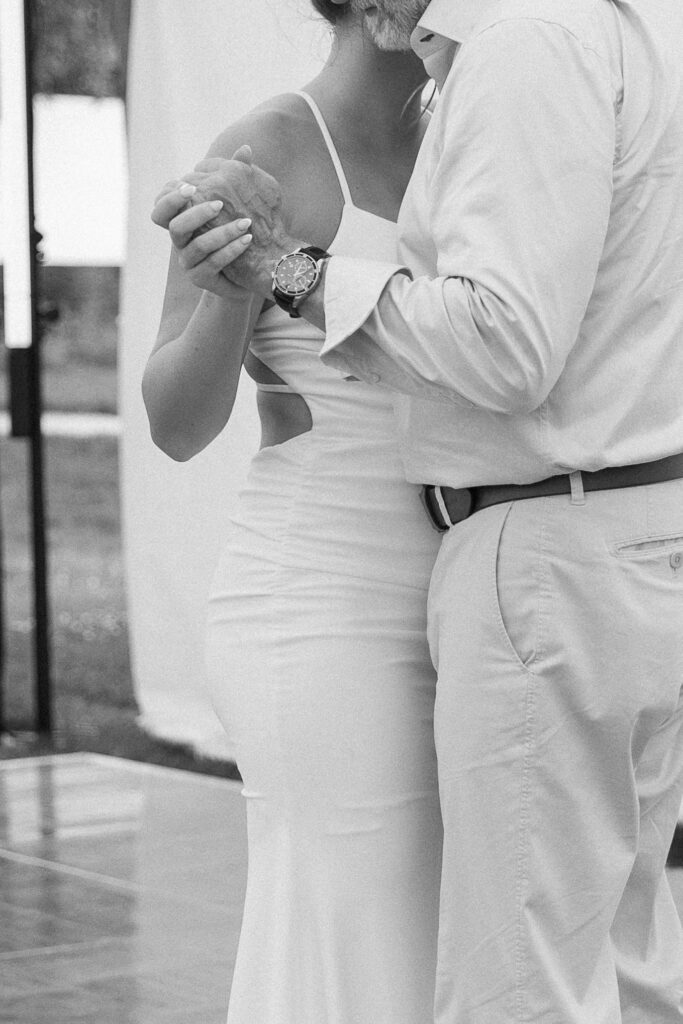 Wedding Photographer VT | Sincerely Liz Photography Documentary and Editorial Wedding Photography | A couple dances closely, capturing an intimate moment.