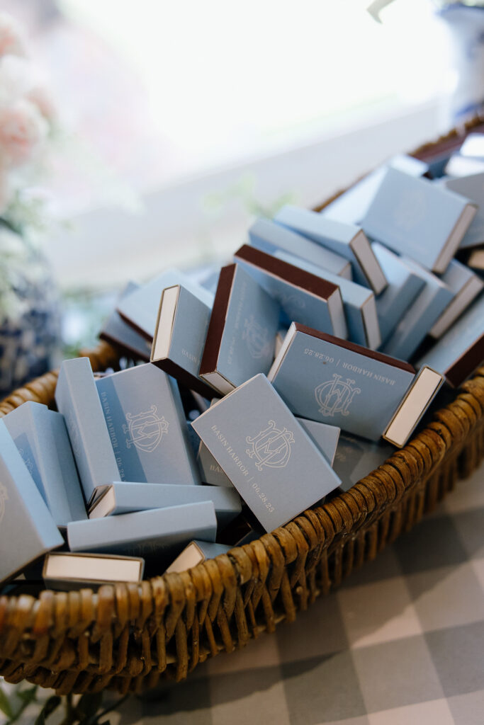 Basket of powder blue wedding favor boxes with gold detailing for a Basin Harbor wedding